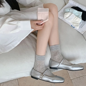 Women's heart cutout crew socks in pastel colors with breathable mesh and rib knit cuffs
