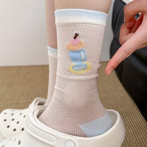Detail of cream crew socks featuring cute ice cream patterns and blue striped cuffs