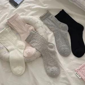 Sweet lace-edge crew socks in cream, pink, grey and black with hollow mesh patterns