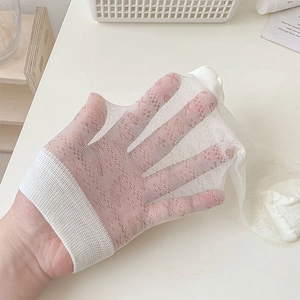 Close-up of white lace heart mesh sock showing breathable hollow texture and elasticity