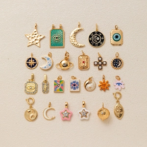 23-piece vintage celestial charm set with 18K gold plating and colorful enamel detail