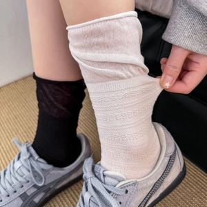 Detailed view of elastic rolled cuff on breathable cotton mesh crew socks for women