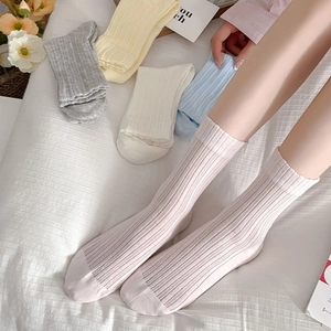 Detail of ribbed mesh breathable cotton crew socks for women in soft pastel colors
