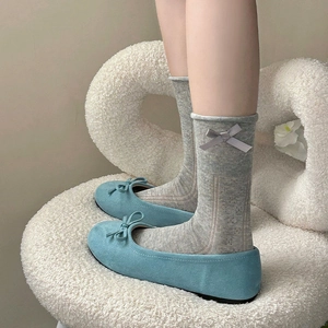 Sweet girl style grey mesh socks with bow decoration and blue ballet flats on model