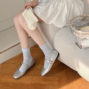 Breathable vertical mesh crew socks shown with silver Mary Jane shoes and blue socks