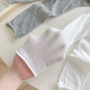 Close-up showing the breathable mesh texture and high elasticity of cotton mid-calf socks