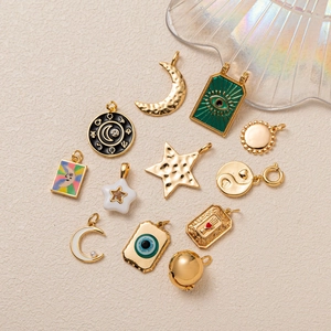 18K gold plated celestial tarot charms with colorful enamel and hamsa hand details