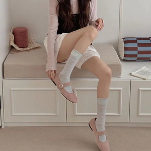 Pink Mary Jane shoes with light blue lace long socks featuring white square label detail
