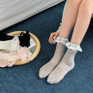 Close-up of vintage lace trim socks in multiple colors with hollow mesh knit details