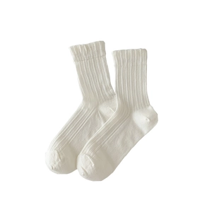 Minimalist white vertical ribbed crew socks with breathable mesh design and elastic cuff