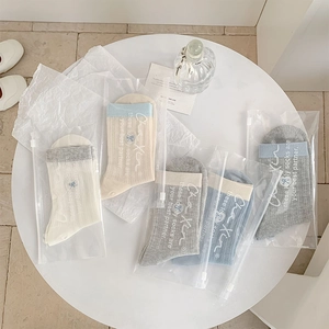 Detail of sweet heart embroidery mesh socks in multiple colors with gift packaging