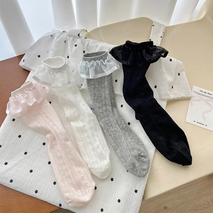 Flat lay view of four pairs of cotton lace socks in pink, white, grey, and black colors