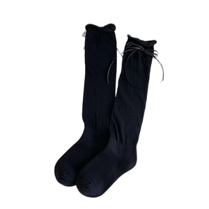 Japanese JK style knee high socks featuring sweet black bows and ruffled edges for women