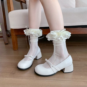 Detail of white lace Lolita calf socks paired with bow-knot Mary Jane shoes for girls