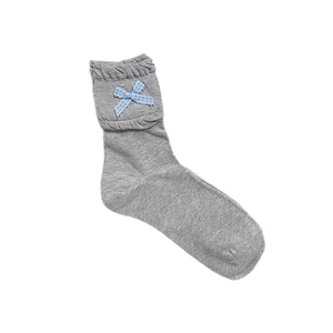 Grey knit socks with ruffle cuffs and light blue plaid bow tie on white background