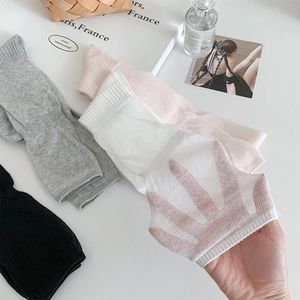 Close-up of lightweight breathable summer socks in various colors with mesh texture