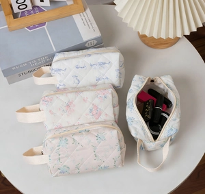 Quilted cotton floral pouch set with blue cat pattern showing interior storage capacity