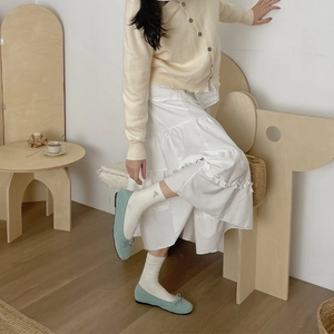 Mint green suede ballet flats with bow detail paired with white ribbed knit socks