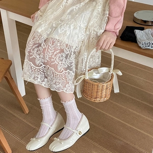 White wood ear edge lace socks with mesh pattern paired with Mary Jane leather shoes