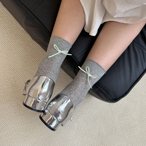 Japanese style grey mesh socks with light green heel bow paired with silver Mary Janes
