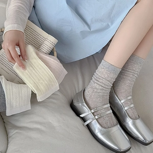 Breathable hollow-out mesh crew socks in pastel colors styled with silver Mary Jane shoes