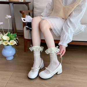 Lolita style white lace socks with ribbon bows paired with white Mary Jane shoes for women