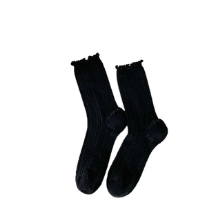 Japanese style black cotton crew socks with ruffle trim and vertical ribbed knit texture