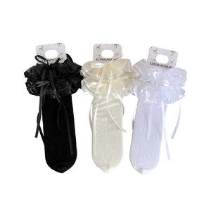 Lolita lace crew socks in black, cream, and white with ribbon bows and ruffles