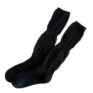 Japanese style black knit slouch socks featuring ribbed texture and elastic design