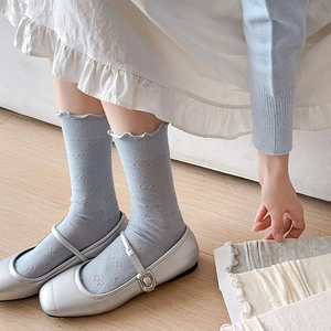 Chaussettes bleues style ballet avec motifs nœuds et bordure à volants pour femme
