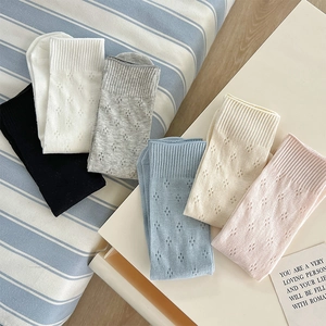 Detail of six-color crew socks set with hollow diamond pattern and ribbed cuffs