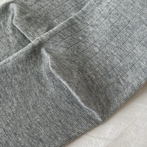 Macro detail of grey ribbed knit fabric texture on Japanese style sweet lace socks