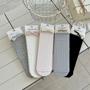 Detailed view of five-color lace trim cotton socks with ribbon bows and ribbed texture