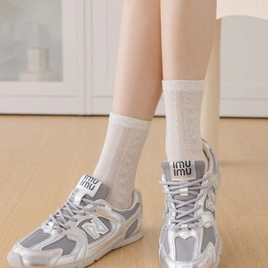 Silver metallic and mesh sneakers with ballet heart socks for a stylish casual look