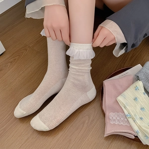 Macro detail of beige Japanese style socks with delicate lace trim and knit texture
