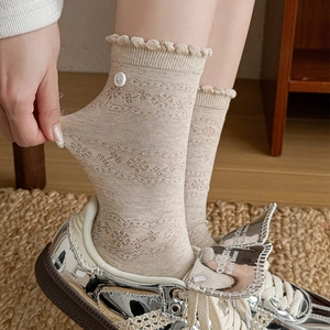 Beige hollow lace crew socks for women featuring ruffle cuffs and decorative side buttons