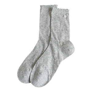 Light gray mid-calf socks with hollow-out mesh patterns and decorative buttons