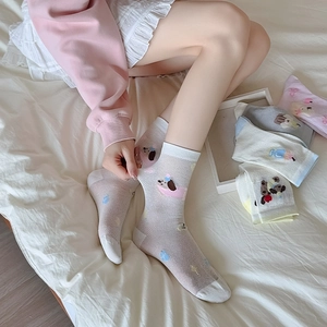 Close-up of breathable mesh socks with cute puppy patterns in various pastel colors