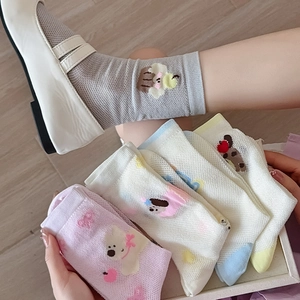 Detailed view of breathable mesh summer socks with cute cartoon animal embroidery
