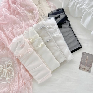 Flat lay of sheer tulle Lolita socks in four colors with delicate mesh bow details