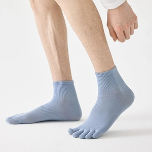 Detail of light blue men's five-finger socks with ribbed cuffs and toe separation design