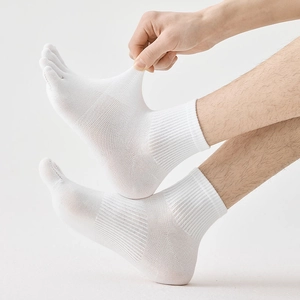 Detail showing breathable mesh structure and five-finger design of white cotton sports socks