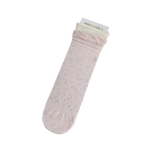 Sweet pink confetti knit crew socks with ruffled edges and vertical ribbed texture
