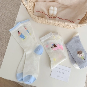 Detail of breathable mesh cotton socks with cute cartoon puppy and ice cream patterns