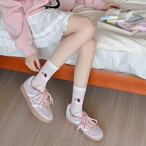 Detail of cute cartoon dog pattern on breathable mesh crew socks for women