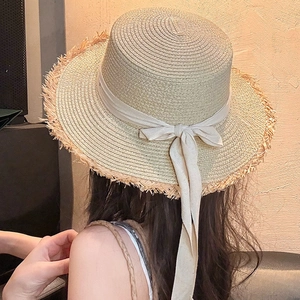 Women's summer straw sun hat with raw edge and elegant yellow bow ribbon