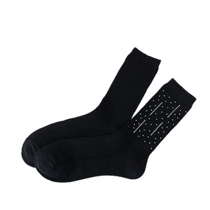 Fashionable black knit crew socks with sparkling rhinestone dots in minimalist style
