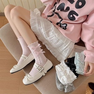 Detail of ballet style ruffle socks with pink bows shown in multiple colors and textures