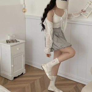 Sweet preppy outfit featuring white lace top, pleated skirt, and cherry pattern socks