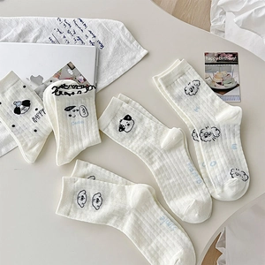 Detailed view of white cotton socks with cute cartoon dog prints and positive lettering